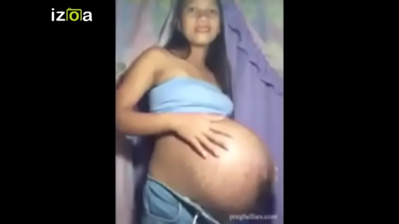 Pregnant Jade posing and showing mega belly