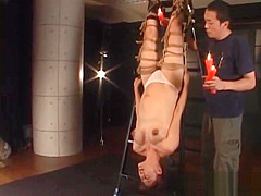 Roped asian pregnant slave gets wax dripped on her